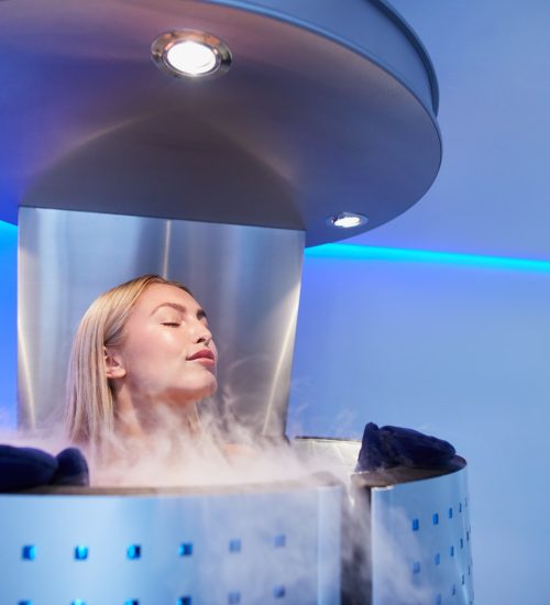 Young woman in a whole body cryo sauna
